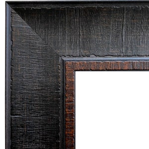 May include: Close-up of the corner of a black wood picture frame with a brown inner edge.