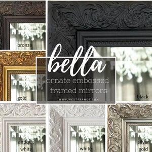 May include: A collage of ornate, embossed framed mirrors in various colors, including bronze, black, gold, antique white, white, and silver gold. The mirrors have detailed, carved frames and reflect a chandelier. The word "bella" is displayed in the center.