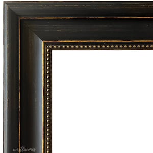 May include: Black picture frame with a gold trim and a row of gold beads around the edge.