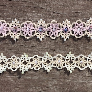 May include: Two delicate crocheted bracelets with pearl-like beads. The top bracelet is pink and white, while the bottom bracelet is cream and white.