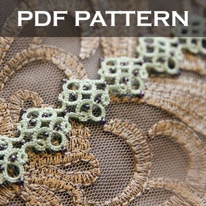 May include: A close-up of a delicate green lace trim with small black beads, featuring a repeating geometric pattern. The lace is sewn onto a brown mesh fabric. The text "PDF PATTERN" is displayed above the lace.