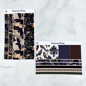 May include: Two sheets of Halloween themed planner stickers. The first sheet features a repeating pattern of bats, pumpkins, and a vintage book. The second sheet features a repeating pattern of ravens, a damask pattern, and a black and white pattern of a repeating symbol.