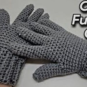 May include: A pair of gray crocheted gloves with full fingers. The gloves are made with a simple stitch pattern and have a ribbed cuff.