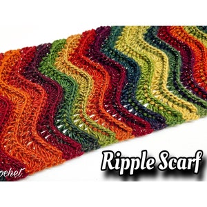May include: A colorful crochet ripple scarf with a wavy pattern. The scarf is made with a yarn that has a subtle sparkle. The text "Bag-O-Day Crochet" and "Ripple Scarf" are visible in the image.