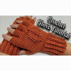 May include: A close-up of a pair of orange crocheted fingerless gloves. The gloves are made with a simple stitch pattern and have a ribbed cuff. The text "Crochet Glove Tutorial" is visible in the image.