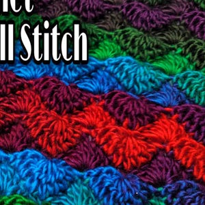 May include: A close-up of a colorful crocheted fabric with a shell stitch pattern. The fabric is made with different shades of green, blue, red, and purple yarn.