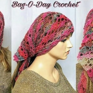 May include: A crocheted head scarf with a lacy pattern in shades of pink, gray, and beige. The scarf is worn by a mannequin with long brown hair. The text "Bag-O-Day Crochet" is displayed at the top of the image.