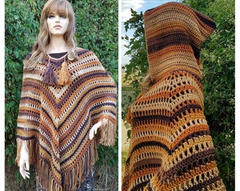 May include: A brown, beige, and orange striped crochet poncho with a hood and fringe. The poncho is made with a lacy stitch pattern.