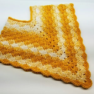 May include: A crocheted shawl in yellow and white with a scalloped edge.