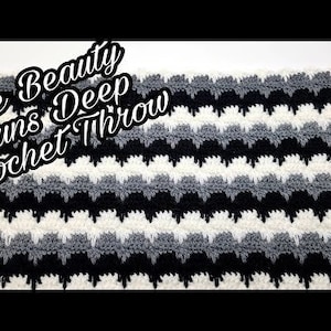 May include: A black, white, and gray crochet throw blanket with the text "The Beauty Runs Deep Crochet Throw" in black.