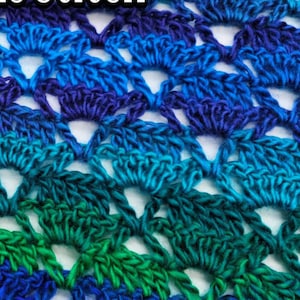 May include: Close-up of a crocheted fabric with a gradient of blue, teal, and green colors. The fabric is made with a repeating pattern of small, rounded shapes.