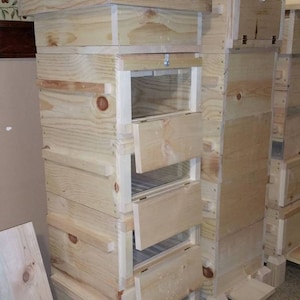 Unassembled Warre Beehive Kit. With observation windows in each box.