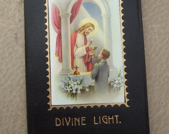 Vintage First Holy Communion Child's Prayer Book Missal  - black cover with Jesus giving Holy Communion to Boy