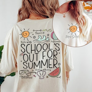May include: Ivory t-shirt with the text "SCHOOL'S OUT FOR SUMMER" and summer-themed graphics. The back of the shirt features a sun, waves, and watermelon illustrations. The shirt also has the text "dear parents, tag you're it, teacher off duty, hello summer, I love you all, class dismissed, beaching not teaching, we out."