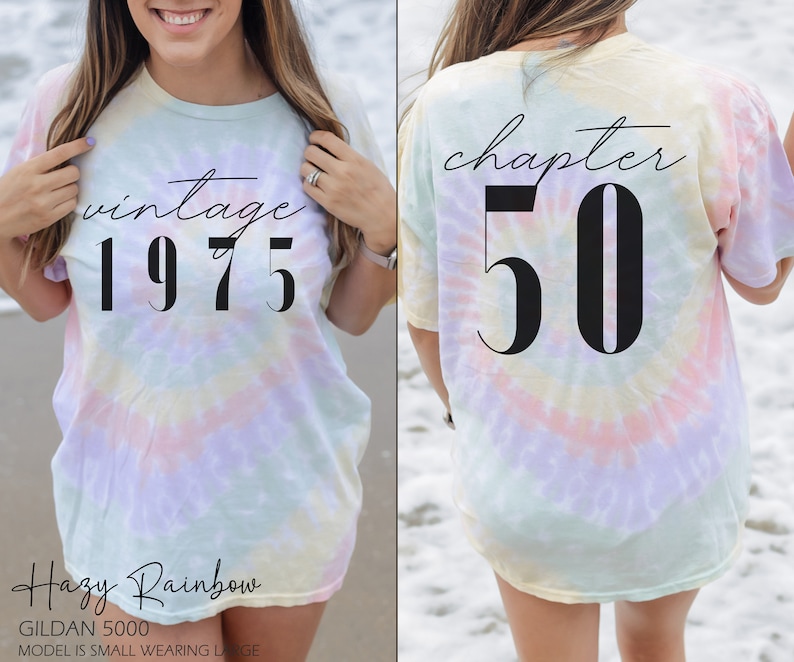 May include: A tie-dye t-shirt with the text "vintage 1975" on the front and "chapter 50" on the back. The shirt is a hazy rainbow color.