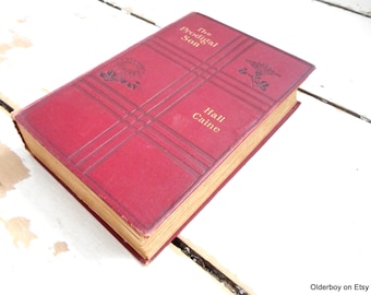 Könnte beinhalten: Ein rotes Hardcover-Buch mit goldfarbenem Rücken. Der Titel "The Prodigal Son" und der Autor "Hall Caine" sind auf dem Einband aufgedruckt.