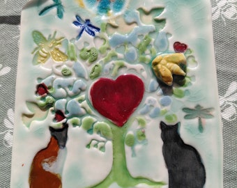 Porcelain plaque with cats and a tree of life