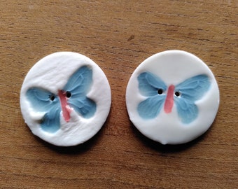 Two butterfly buttons