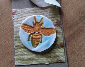 Yellow bee button