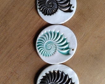 Three ammonite decorations