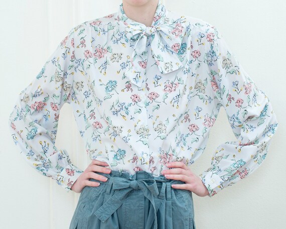 ML 1970s orange and blue abstract blouse 70s vintage pussy bow draped button-front rayon shirt with abstract floral print