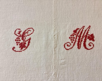 Antique linen/cotton (Métis) sheet with a GM monogram in Red Cross stitch. Hand loomed with a central hand sewn seam - over 100 years old.