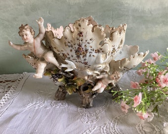 Glorious antique vase with angels. Porcelain vase with cherubs. Barbotine vase with angels and birds.