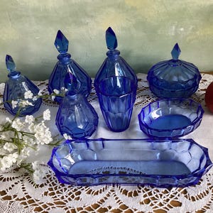 8 vintage French blue glass bottles. Bottles in blue glass for beauty products. Decorative vintage blue glass bottles.