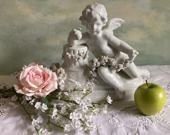 Original large antique Capodimonte putto or cherub in white porcelain. White porcelain angel with fine detail,  perfect condition. Stamped.