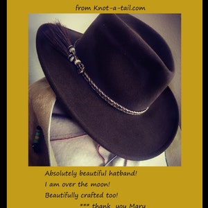 May include: A brown felt cowboy hat with a horsehair hatband. The hatband is braided with a white and brown pattern. The hat has a small brown horsehair tassel. The text "Horsehair hat band ** Chocolate brown from Knot-a-tail.com" is visible in the image.