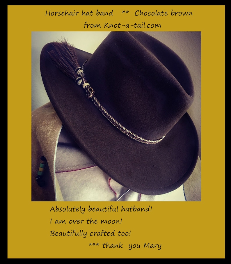 May include: A brown felt cowboy hat with a horsehair hatband. The hatband is braided with a white and brown pattern. The hat has a small brown horsehair tassel. The text "Horsehair hat band ** Chocolate brown from Knot-a-tail.com" is visible in the image.