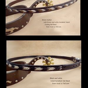 May include: Two leather cowboy hat bands with a spur buckle. The top band is brown leather with a brown and white horsehair insert. The bottom band is black leather with a black and white horsehair insert. Both bands have the text "from Knot-a-Tail.com".