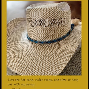 May include: A close-up of a light brown straw cowboy hat with a blue and white braided hat band. The hat has a woven design and a small brown tassel. The text "Love the hat band, rodeo ready, and time to hang out with my honey. Thank u. *** David" is visible at the bottom of the image.