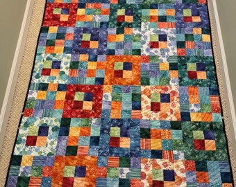 Patchwork colorful quilted throw, wall hanging, or decor