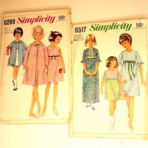 May include: Two vintage Simplicity sewing patterns for girls' dresses. The pattern on the left is number 6289 and is for a girl's dress with a matching jacket. The pattern on the right is number 6517 and is for a girl's dress with a ruffled collar and sleeves.