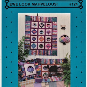 May include: A quilt pattern featuring a patchwork design with a sheep motif. The quilt is made with a variety of colourful fabrics, including plaid, stripes, and solids. The quilt is titled "Ewe Look Mahvelous!" and is numbered #124.