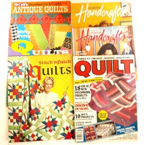 May include: A collection of vintage quilting magazines featuring colorful quilt designs and patterns. The magazines include titles like "Antique Quilts", "Stitch'n Patch Quilts", and "Quilt".