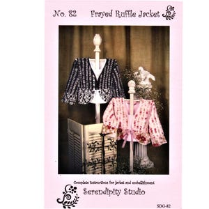 May include: A sewing pattern titled No. 82 Frayed Ruffle Jacket by Serendipity Studio. The cover displays two jackets on stands: one black and white with a floral pattern, and one pink and white with a floral pattern and a ribbon tie closure.
