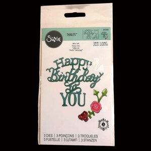 May include: A package of Sizzix Thinlits dies for crafting. The package features the words "Happy Birthday YOU" in green, along with floral accents. The package also includes the text "3 DIES | 3 POINÇONS | 3 TROQUELES" and the Sizzix logo.