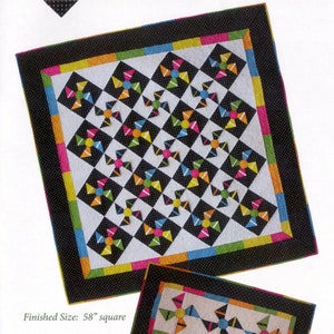 May include: A black and white quilt with a geometric pattern of colorful pinwheels. The quilt is bordered with black fabric with white polka dots and a multi-colored border. The quilt is 58 inches square. Finished Size: 58" square