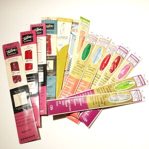 May include: A selection of vintage Talon zips in a variety of colours and lengths, including red, green, blue and pink. The packaging features the Talon logo and the words "The Fashion Right Zipper".