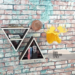 May include: Two triangular wooden shelves with a black finish, mounted on a brick wall. The top shelf has the word "Smile" written on it. The bottom shelf has a small Buddha statue and books. The text "Mini Modern Style" is written on a small rectangular sign below the shelves.