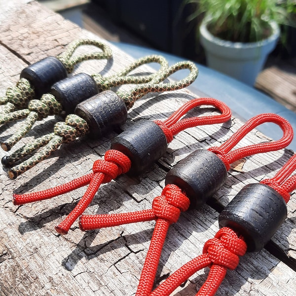 7000 year-old lanyard bead in Bog Oak on knotted 550 paracord in red and diamond pattern | Barrel-shaped Everyday carry knife beads