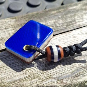 Blue pocket stone with Juma ivory snake core | 1970s Vintage Westinghouse canvas micarta back. Handmade soapbar & matching lanyard bead
