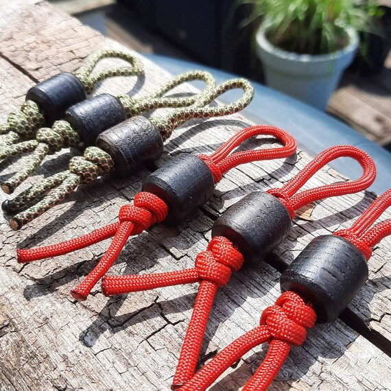 7000 year-old lanyard bead in Bog Oak on knotted 550 paracord in red and diamond pattern | Barrel-shaped Everyday carry knife beads