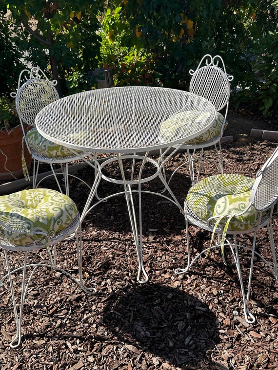 Wrought iron patio table and 4 chairs online