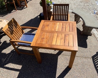 New teak patio set, table and 2 armchairs, can be used indoors or outdoors, table measures 35.5" L and 30" H,