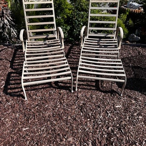 Set of 2 chaise lounge chairs with adjustable back and 2 matching ottomen, made with cast aluminum, never rusting material, leaf pattern