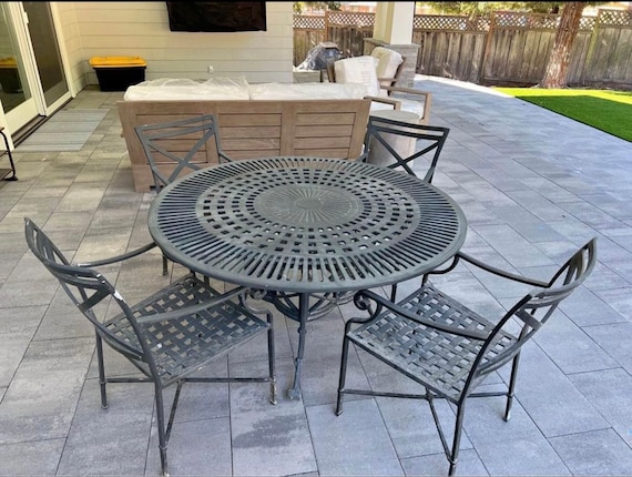 round cast iron patio table and chairs