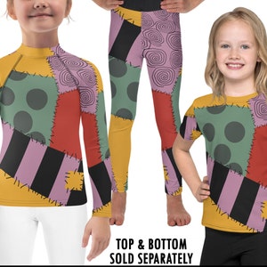 May include: A long-sleeved shirt and leggings set for kids featuring a patchwork design inspired by the character Sally from the movie The Nightmare Before Christmas. The fabric is yellow, green, red, purple, and black with a polka dot pattern and a striped pattern. The text "TOP & BOTTOM SOLD SEPARATELY" is printed at the bottom of the image.